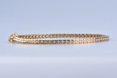 Bracelet en or jaune 18 ct (750/1000). 71 diamants 0,71 ct au total. 2