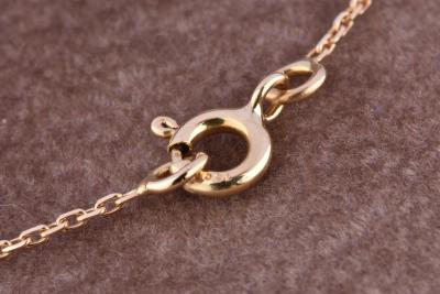 Pendentif  orné d’un oxyde rond de 0.7cm. 2