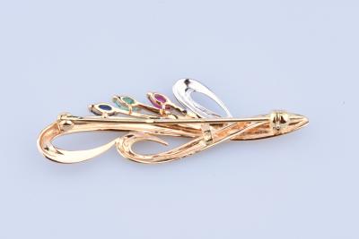 Broche ronde en or composée de 3 pierres précieuses 2