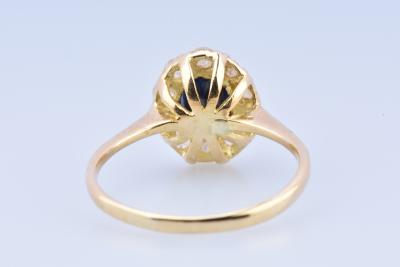 Solitaire ring in 18 carat yellow gold decorated with 1 0.2 carat oval cut sapphire and 10 zirconium oxides. 2