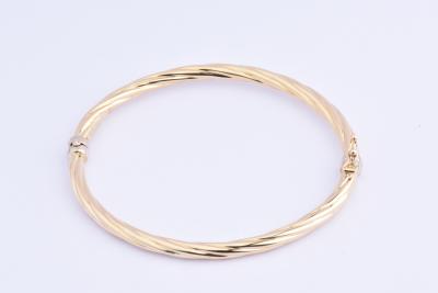 Bracelet rigide en or jaune 18 carats (750 millièmes). 2