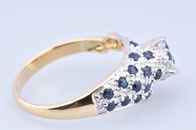 Bague panthère en or bicolore composée de 2 diamants taille brillant de 25 saphirs 2