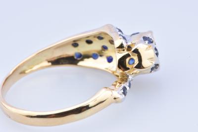 Bague panthère en or bicolore composée de 2 diamants taille brillant de 25 saphirs 2
