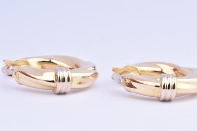 Boucles d’oreilles créoles en or jaune 18 carats (750/1000) torsadées. 2