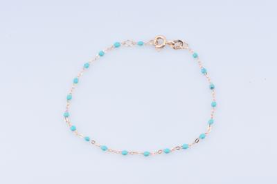 Bracelet en or jaune 18 carats de 16.5 x 0.1 cm, composé de perles de résine turquoises. 2