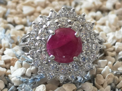 Daisy ring in 18 carat white gold adorned in its centre with a 4.08 carat Burmese unheated ruby and diamonds 2