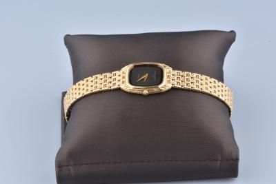 Montre Baume & Mercier en or jaune 18 carats et acier. 2