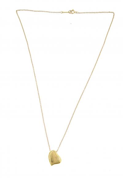 Collier Tiffany & Co en or jaune 18 carats, pendentif coeur coulissant. 2
