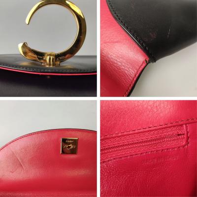 Maxi Pochette Panthère Handtasche aus schwarzem Leder mit rotem Innenfutter. 2