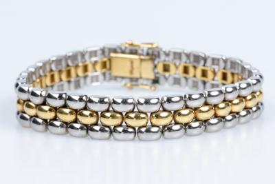 Bracelet CHOPARD souple à maille grain de riz en or jaune 18 carats et acier inoxydable. 2