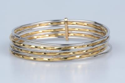 Bracelet semainier en or blanc et jaune 18 carats. 2