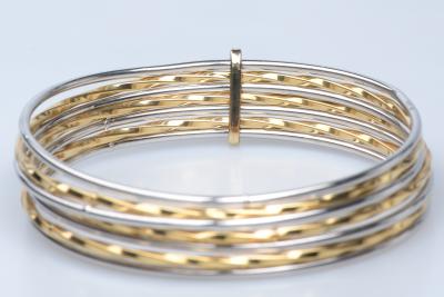 Bracelet semainier en or blanc et jaune 18 carats. 2